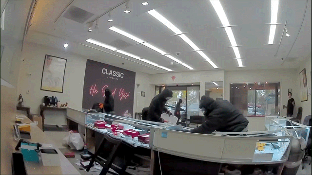 Surveillance GIF shows a car ramming through the entrance of an Anaheim Hills jewelry store during a smash-and-grab robbery.