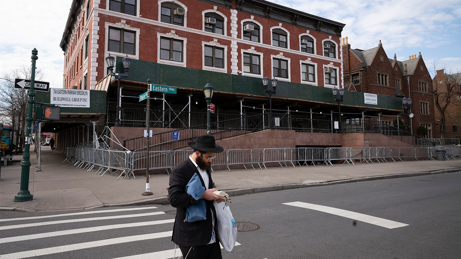 NYPD officers outside the entrance of Chabad Lubavitch World Headquarters in Crown Heights after a vehicle struck the front doors.