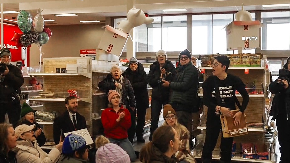 Protesters stage a sit-in inside a Target store in St. Paul, Minnesota, during an anti-ICE demonstration.