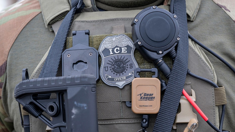 Close-up of an ICE officer's badge; federal authorities say the case began as an immigration arrest in Hartford.