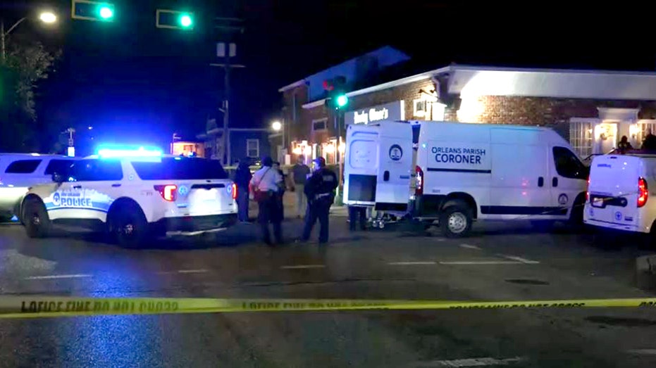 Police respond at the scene outside a New Orleans restaurant after a shooting that injured three tourists and killed a 19-year-old man, according to police.