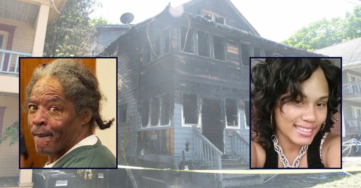 Anthony Green and Shaquoiya Allison against a burned house background in Syracuse, N.Y.