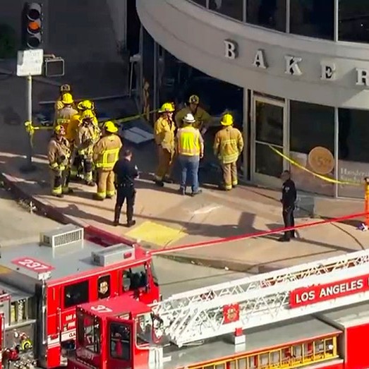 A silver sedan came to rest inside a Westwood grocery store as firefighters and police investigated the crash scene. Credit: Fox News. - foxnews_us
