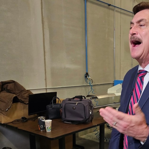 MyPillow CEO and founder Mike Lindell speaks to reporters at his MyPillow factory in the Minneapolis suburb of Shakopee, Minn., on Thursday, Dec. 11, 2025, as he launches his campaign for the Republican nomination to challenge Democratic Minnesota Gov. Tim Walz in 2026. (AP Photo/Steve Karnowski) - lawandcrime